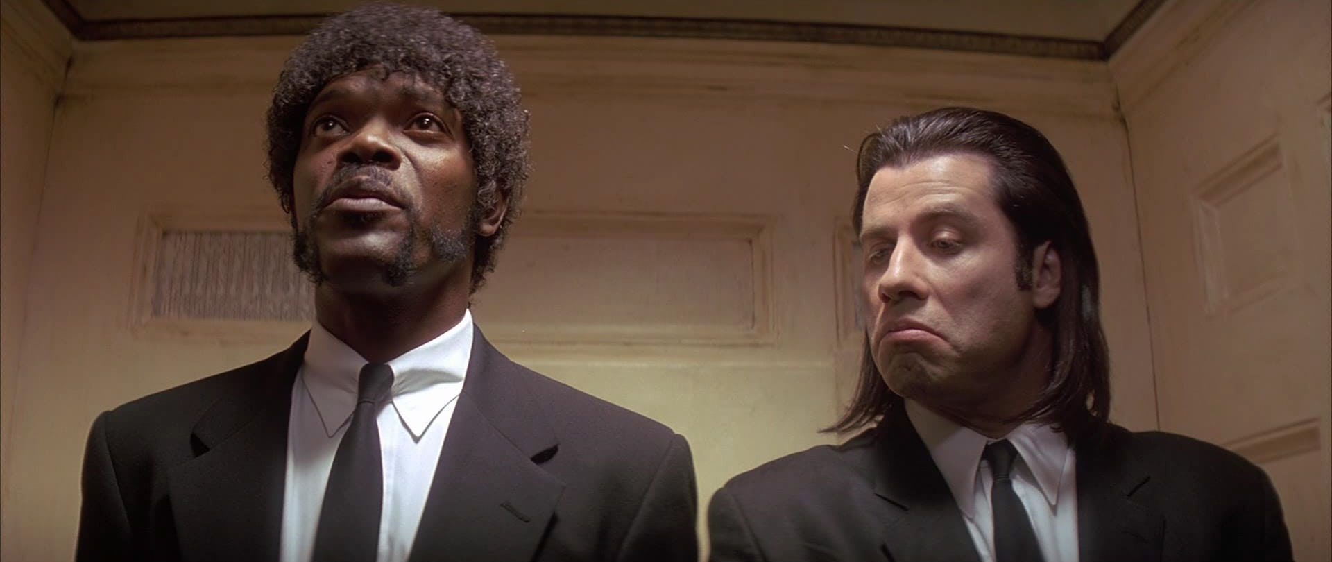 Captura de la película Pulp Fiction de Quentin Tarantino, con Samuel L. Jackson y John Travolta.
