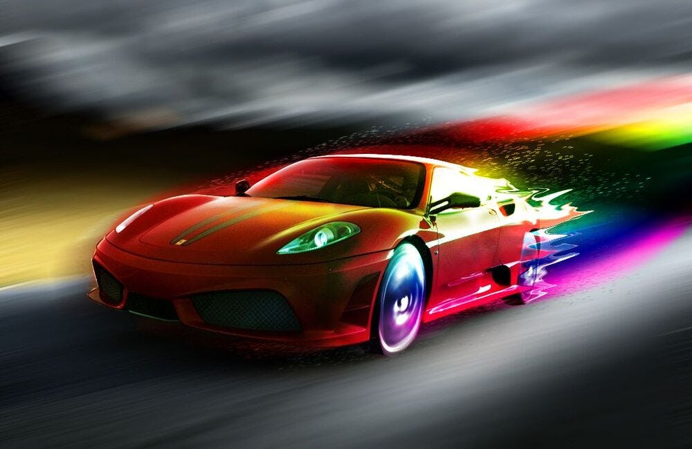 un automóvil deportivo rueda por una carretera